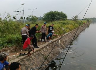 Kapolres Serang Tebar Ikan Nila Merah 2.000 Ekor ke Danau
